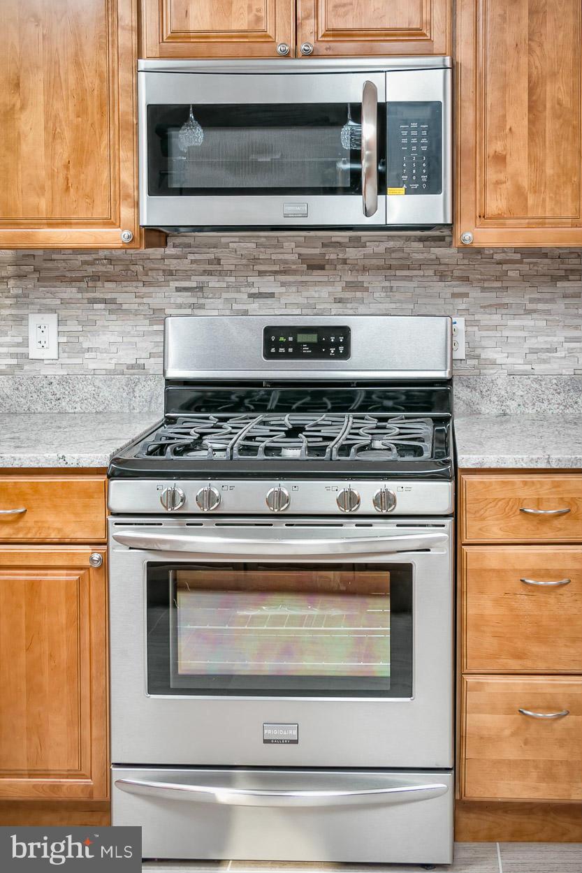 9120 Bengal Road Randallstown, MD 21133 - Photo 30 of 30 a stove top oven sitting inside of a kitchen
