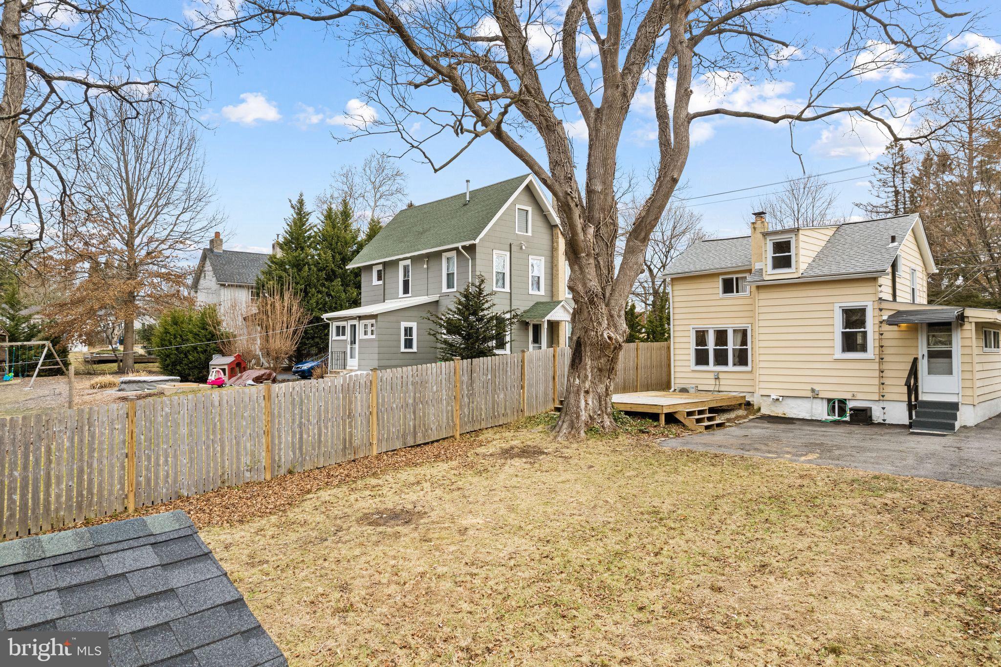 224 South Pennell Road Media, PA 19063 - Photo 22 of 27 a view of a white house with a large tree