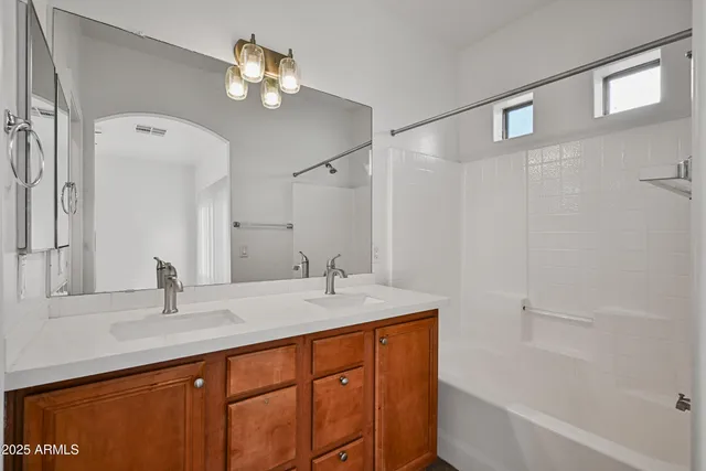 a bathroom with a sink a vanity and a mirror
