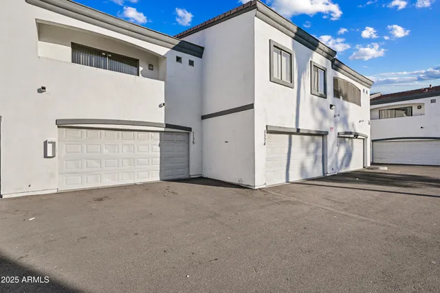 a view of a house with a street
