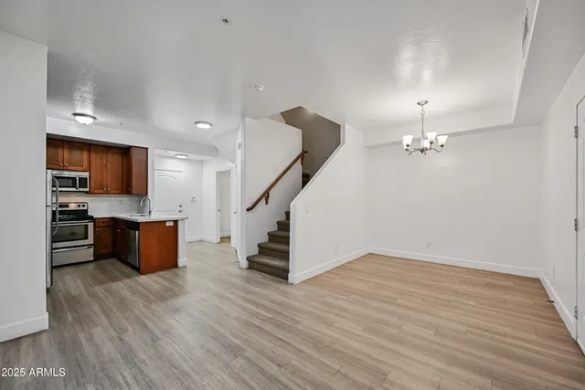 a view of kitchen with cabinets and wooden floor
