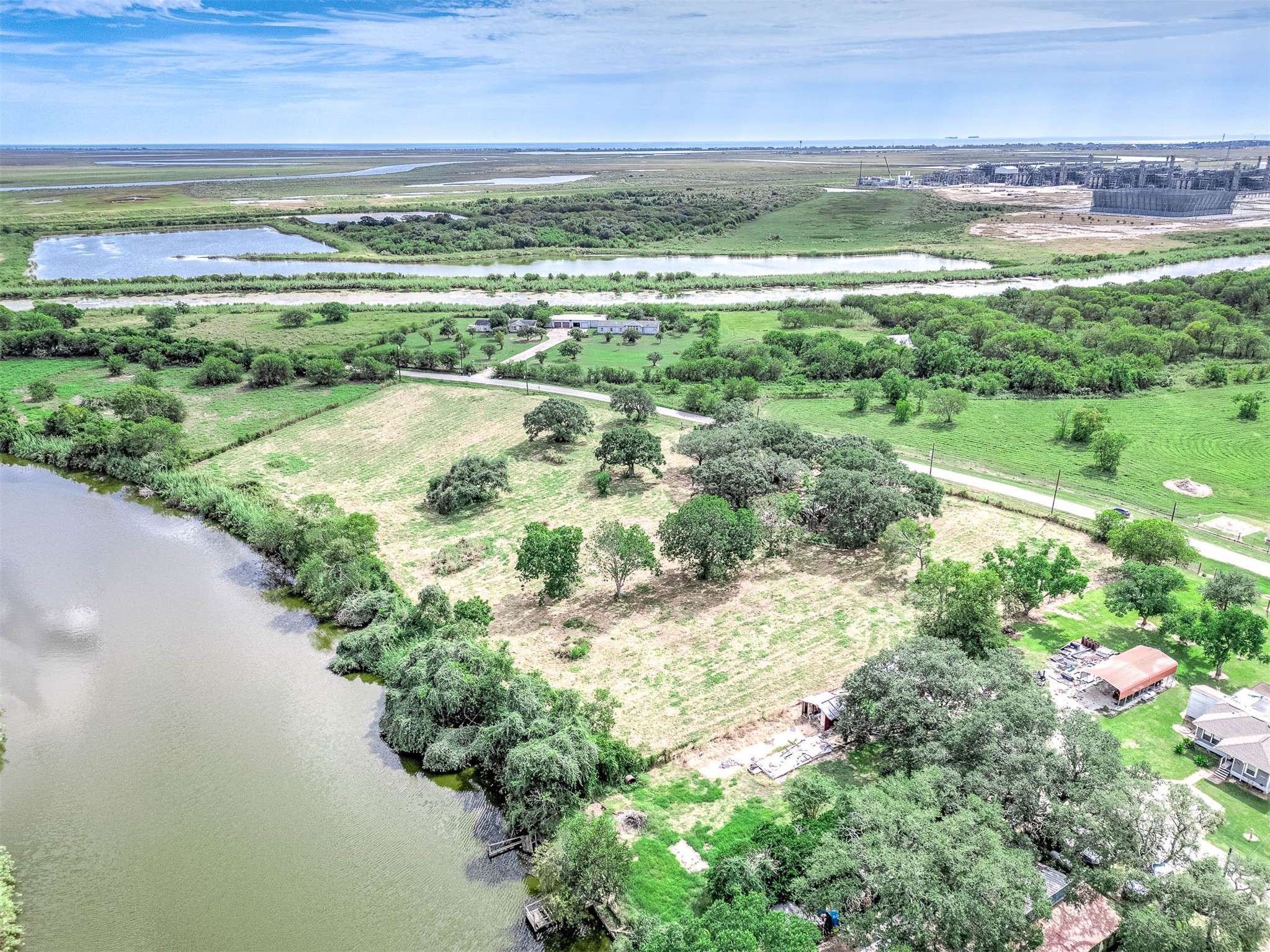 2230 Duncan Drive Freeport, TX 77541 - Photo 3 of 12 a view of a lake with a city