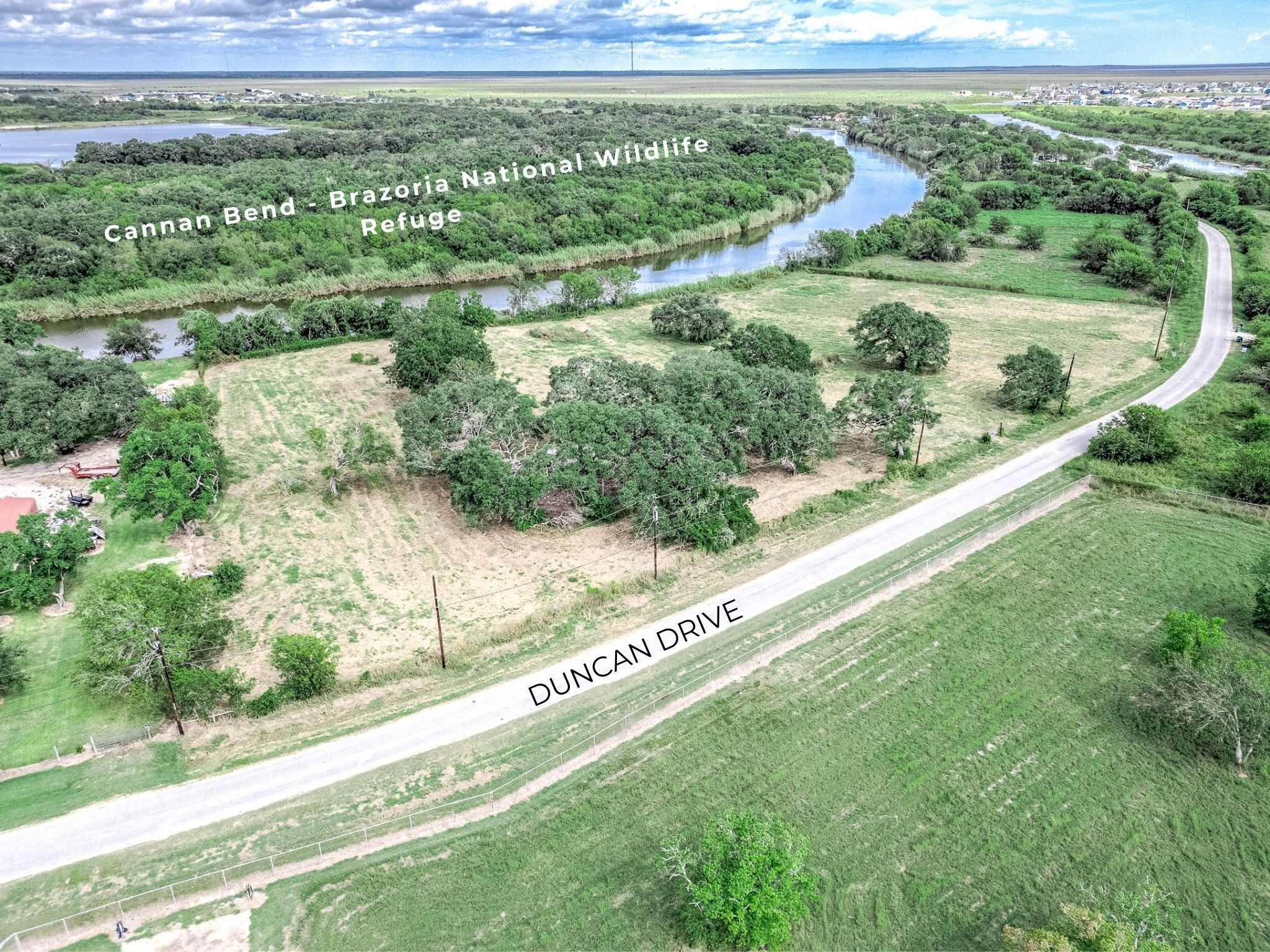 2230 Duncan Drive Freeport, TX 77541 - Photo 6 of 12 a view of a yard with a wooden fence