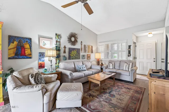 a living room with furniture and a window