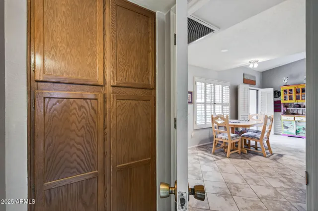 a dining room with furniture and window
