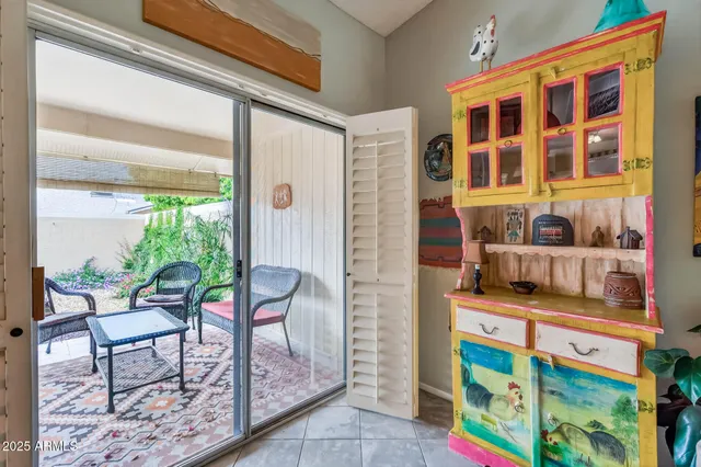 a balcony with table and chairs