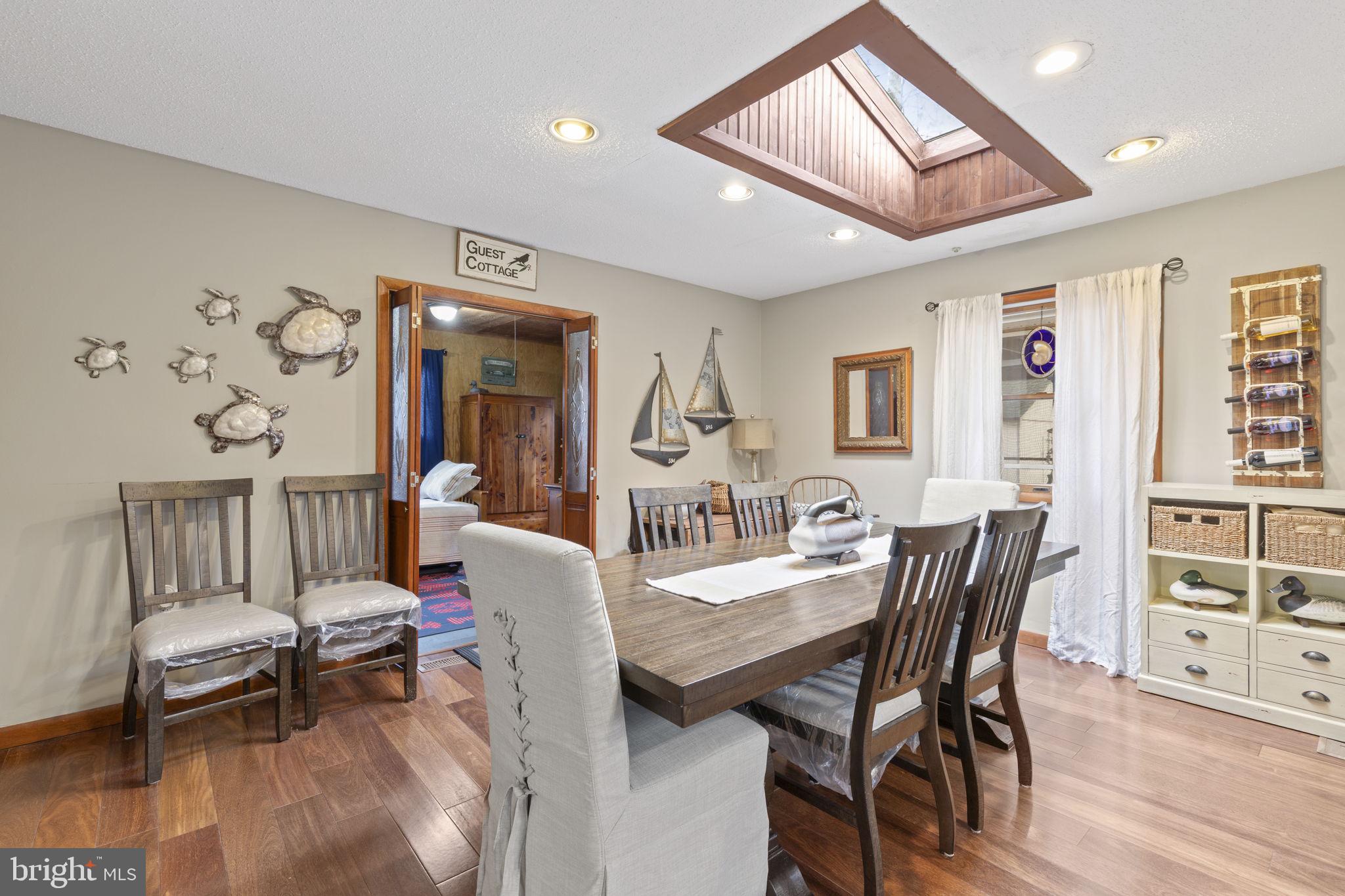 48 Battersea Road Ocean Pines, MD 21811 - Photo 15 of 46 a view of a dining room with furniture and wooden floor