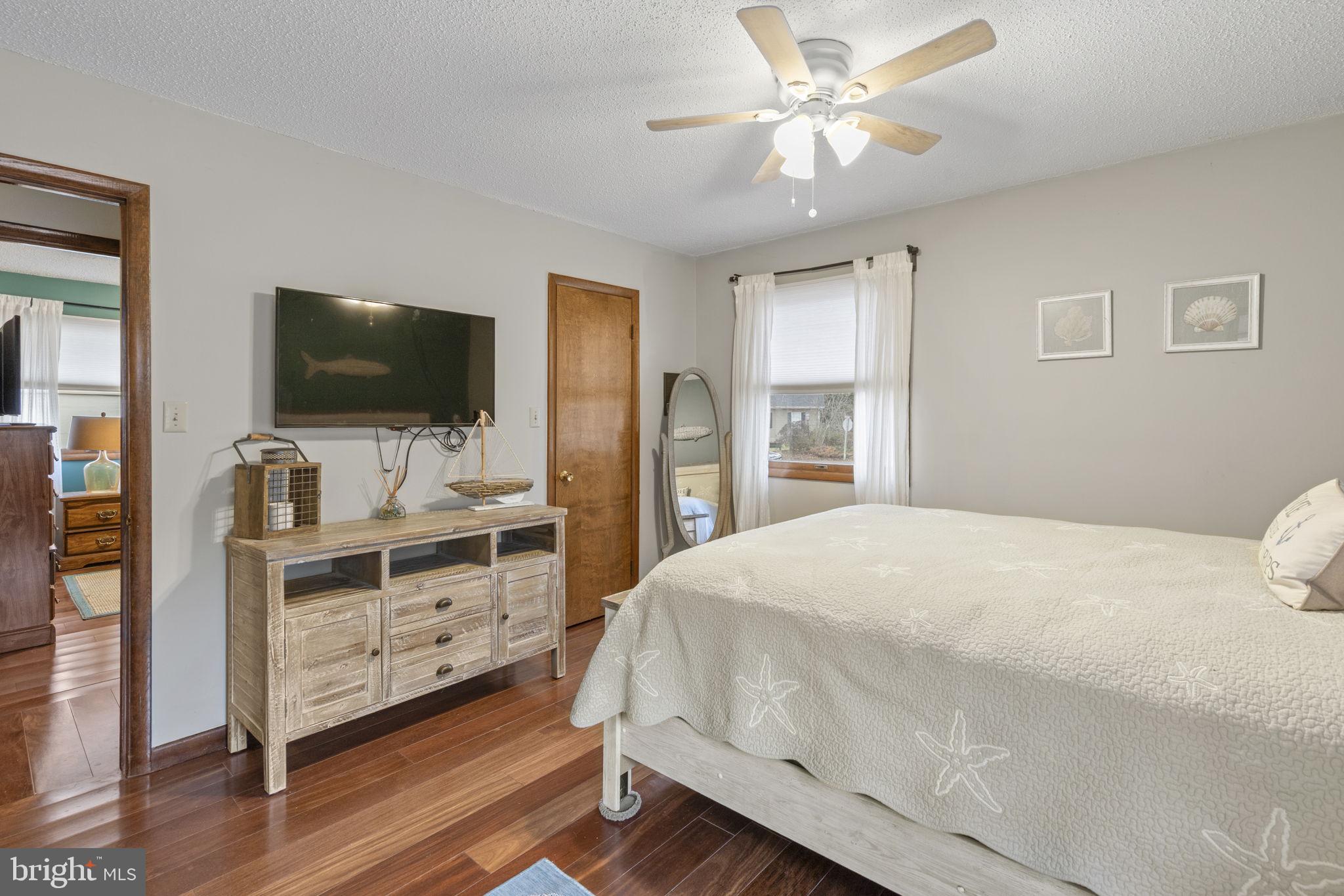 48 Battersea Road Ocean Pines, MD 21811 - Photo 18 of 46 a bedroom with a bed and a flat screen tv