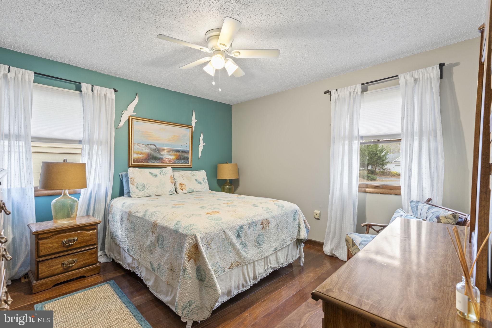 48 Battersea Road Ocean Pines, MD 21811 - Photo 23 of 46 a bedroom with a bed and a chandelier