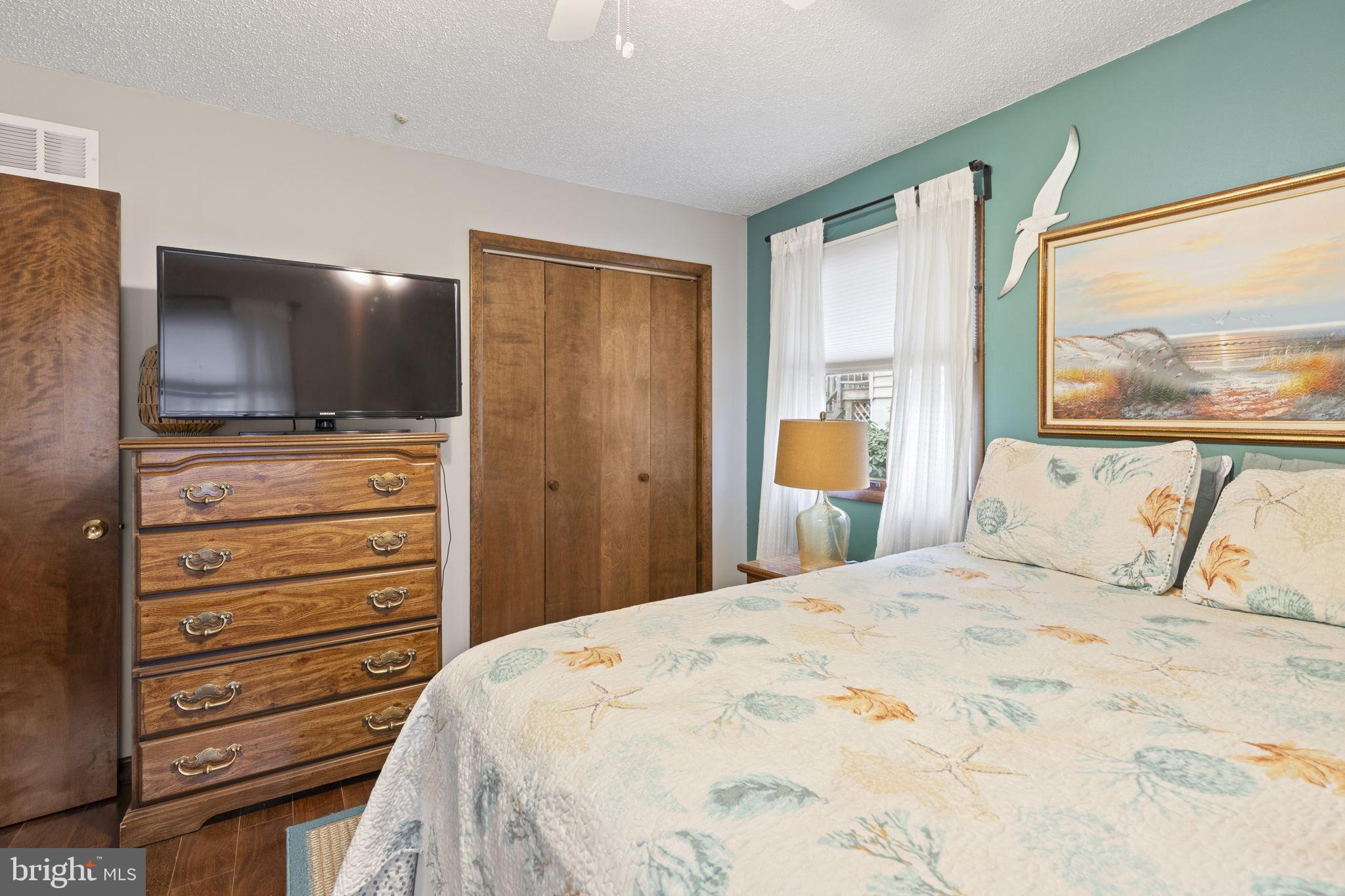 48 Battersea Road Ocean Pines, MD 21811 - Photo 24 of 46 a bedroom with a bed and a flat screen tv