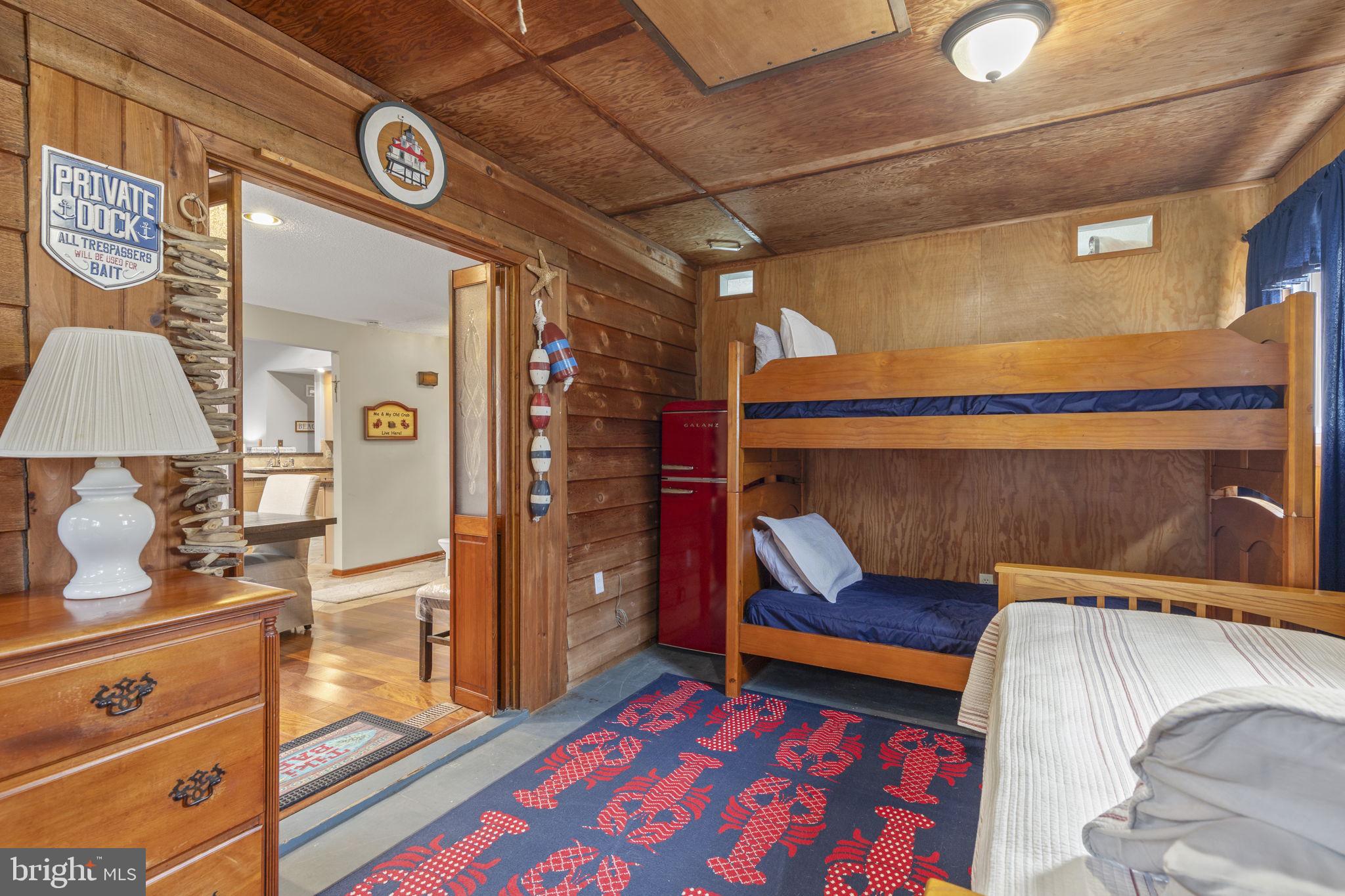 48 Battersea Road Ocean Pines, MD 21811 - Photo 26 of 46 a bedroom with a bed and a lamp on the dresser
