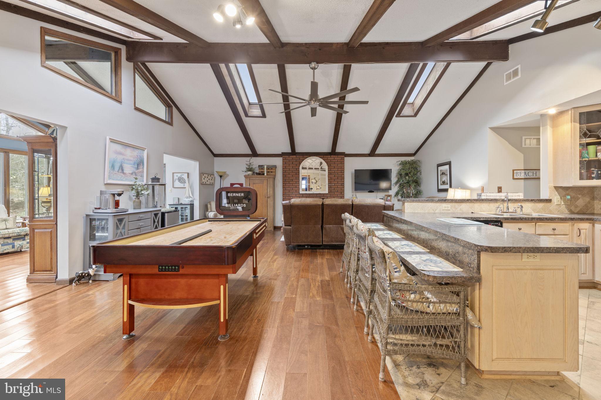 48 Battersea Road Ocean Pines, MD 21811 - Photo 3 of 46 a dining hall with stainless steel appliances granite countertop a stove and a wooden floors