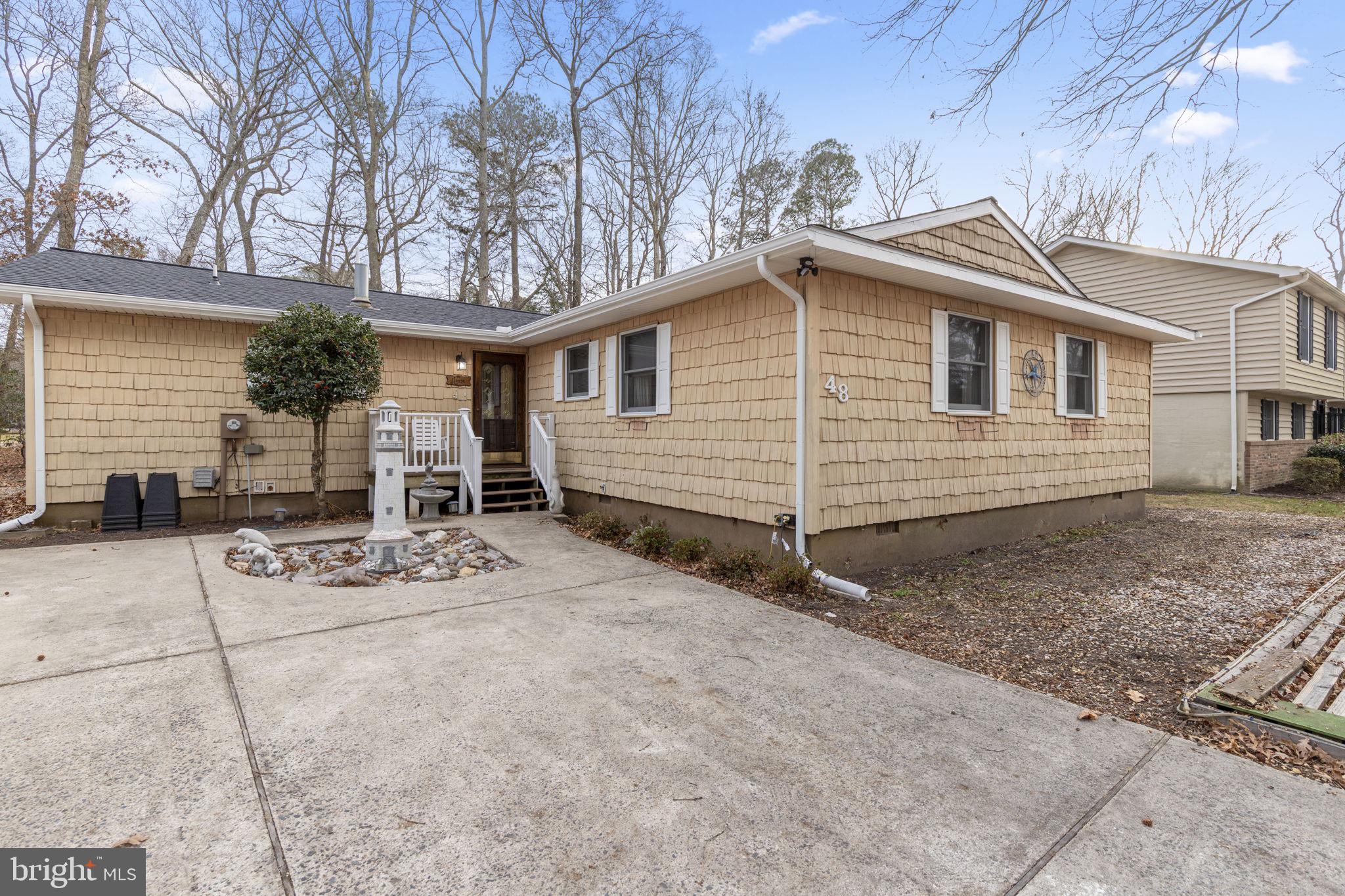 48 Battersea Road Ocean Pines, MD 21811 - Photo 37 of 46 a view of a house with a patio and a yard