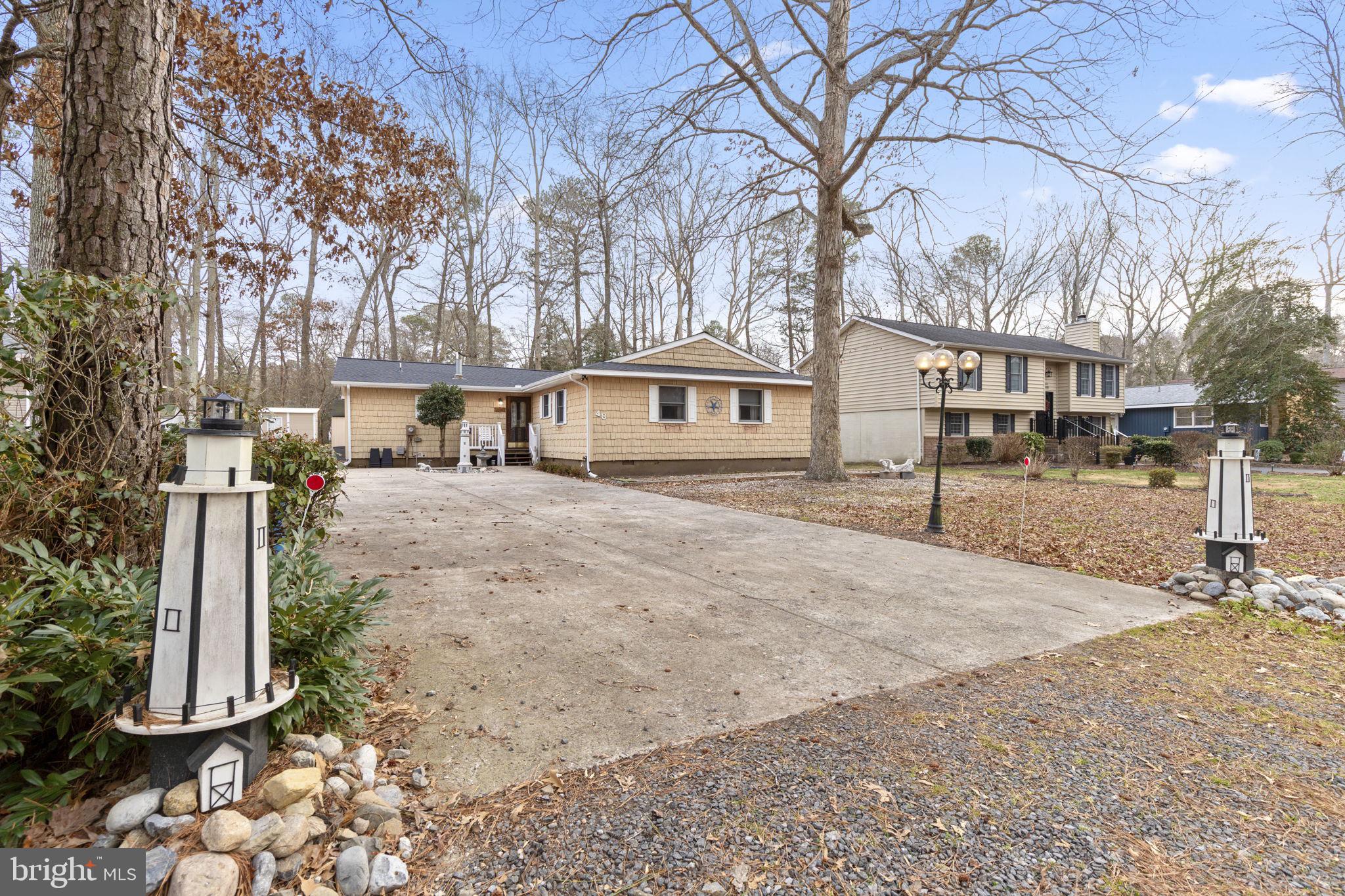 48 Battersea Road Ocean Pines, MD 21811 - Photo 40 of 46 a front view of a house with a yard