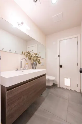 a kitchen with a stove a sink and a refrigerator