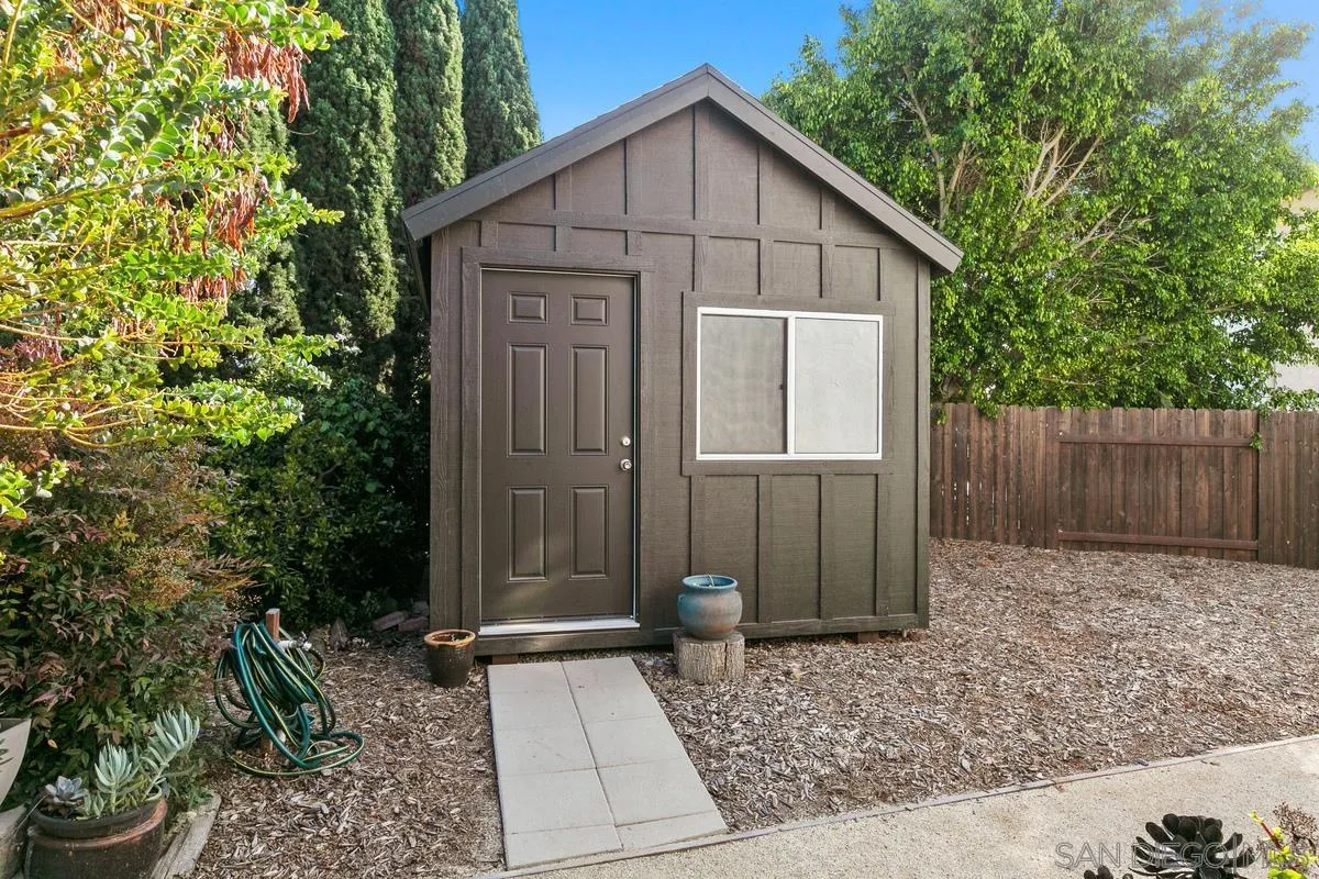 2815 Jacaranda Avenue Carlsbad, CA 92009 - Photo 26 of 30 a view of a small house with wooden fence