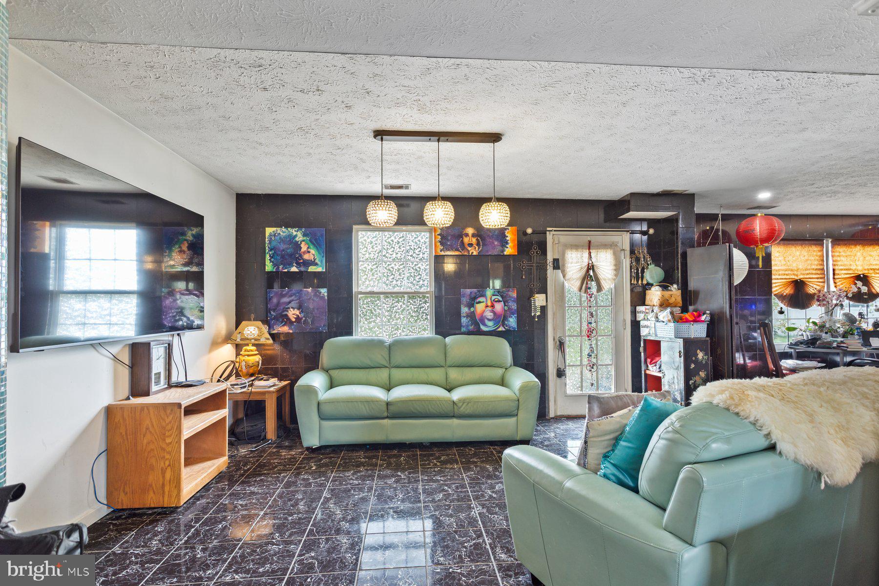2448 Shellcove Court Waldorf, MD 20601 - Photo 4 of 38 a living room with furniture and a flat screen tv