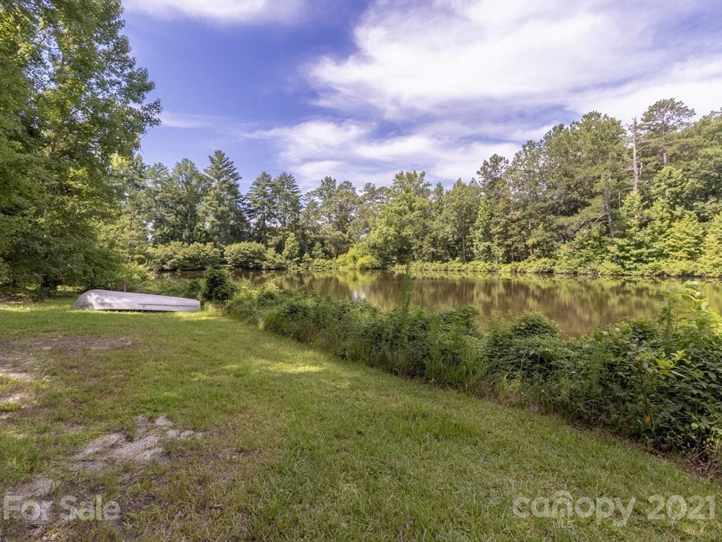 2847 Harmony Road Catawba, SC 29704 - Photo 14 of 17 a view of a lake with a yard