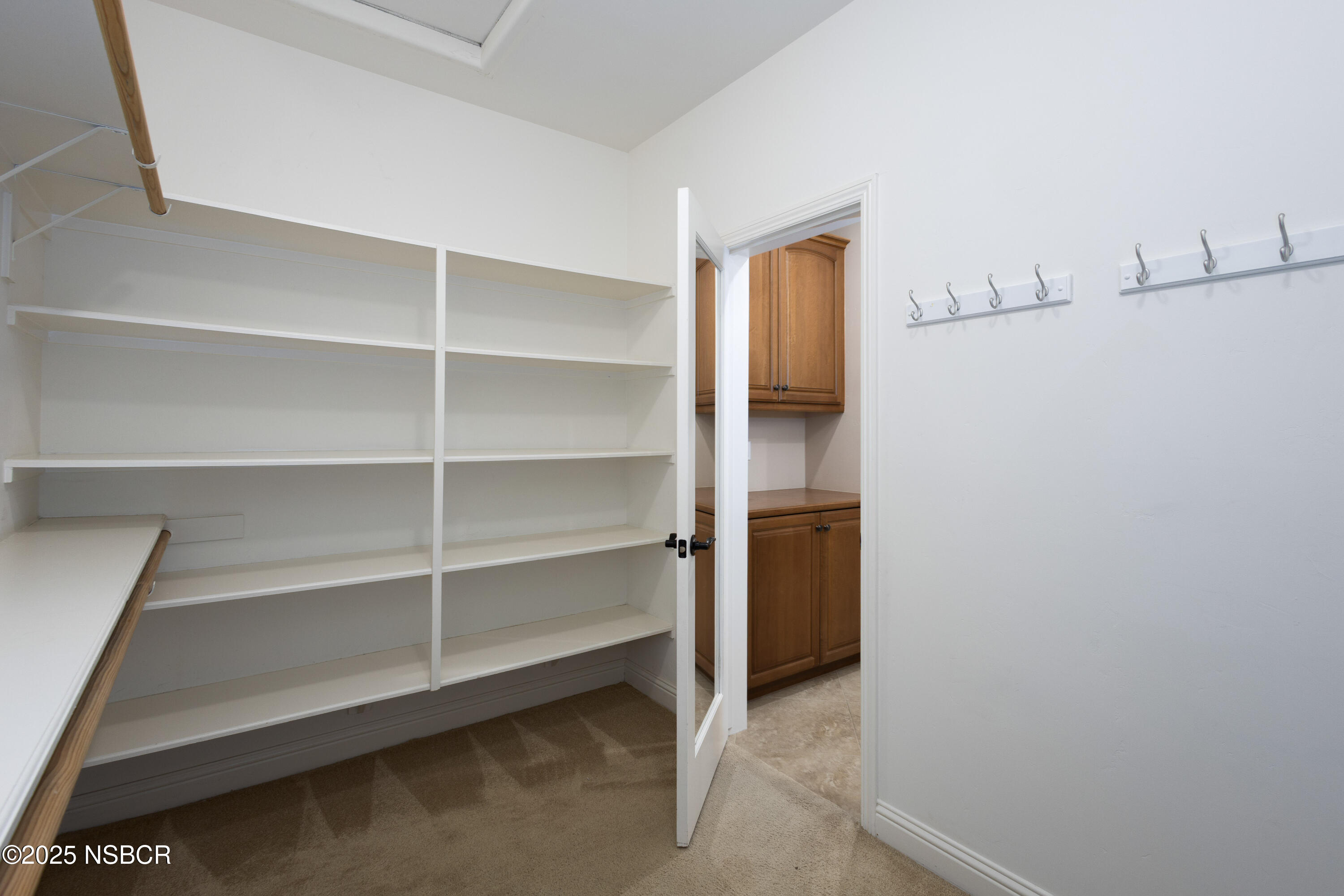 775 Mahogany Street Santa Maria, CA 93455 - Photo 21 of 34 a view of an empty room with empty racks