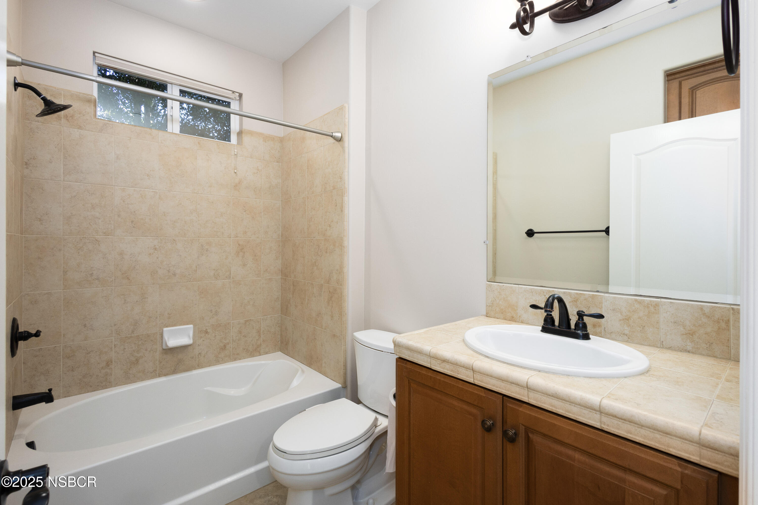 775 Mahogany Street Santa Maria, CA 93455 - Photo 24 of 34 a bathroom with a granite countertop sink toilet and shower