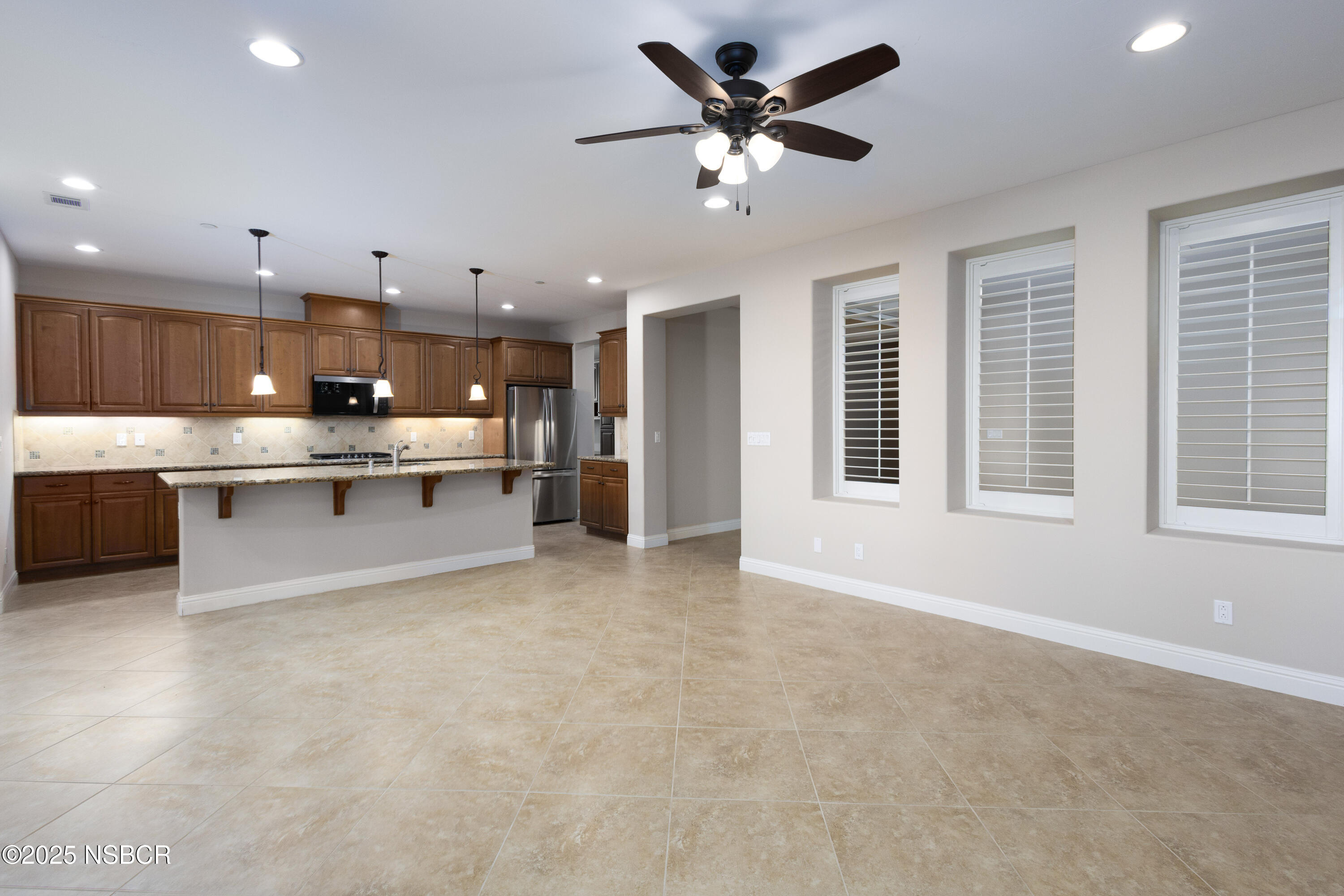 775 Mahogany Street Santa Maria, CA 93455 - Photo 6 of 34 a view of kitchen with kitchen island stainless steel appliances a stove a sink a refrigerator and cabinets