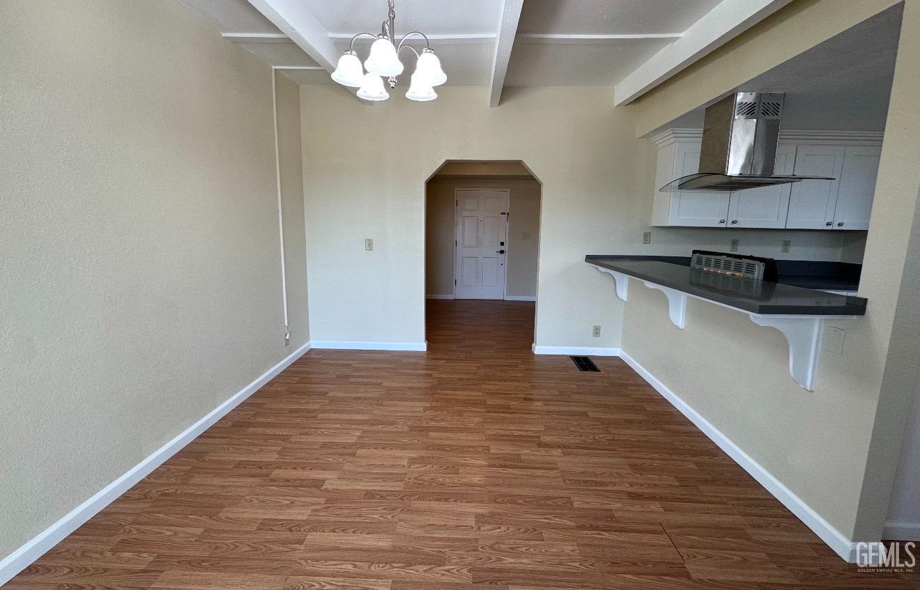 Undisclosed Address Ridgecrest, CA 93555 - Photo 12 of 45 wooden floor in an empty room with a window
