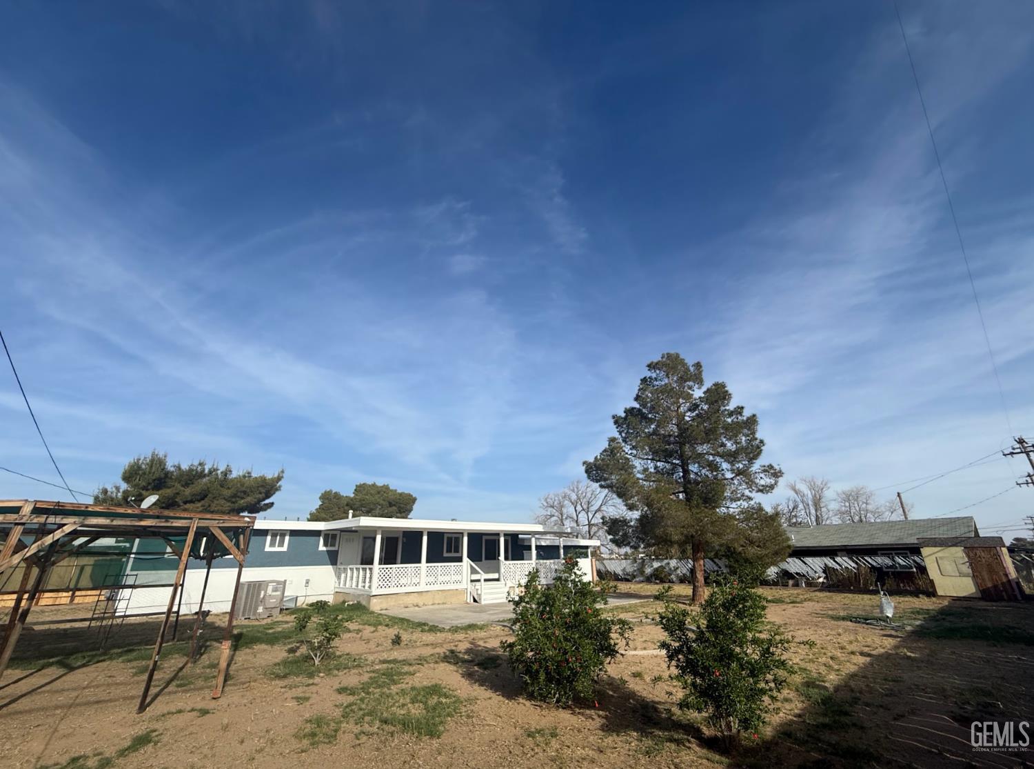 Undisclosed Address Ridgecrest, CA 93555 - Photo 16 of 45 a view of a house with a yard