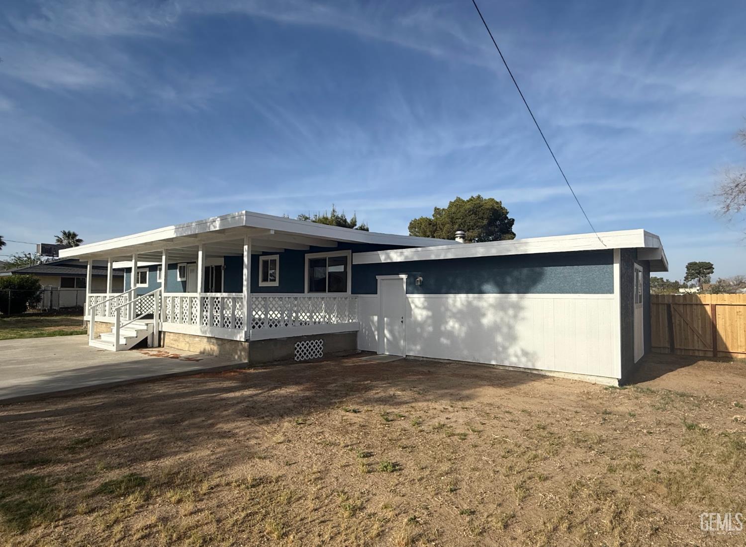 Undisclosed Address Ridgecrest, CA 93555 - Photo 17 of 45 a front view of a house with a yard