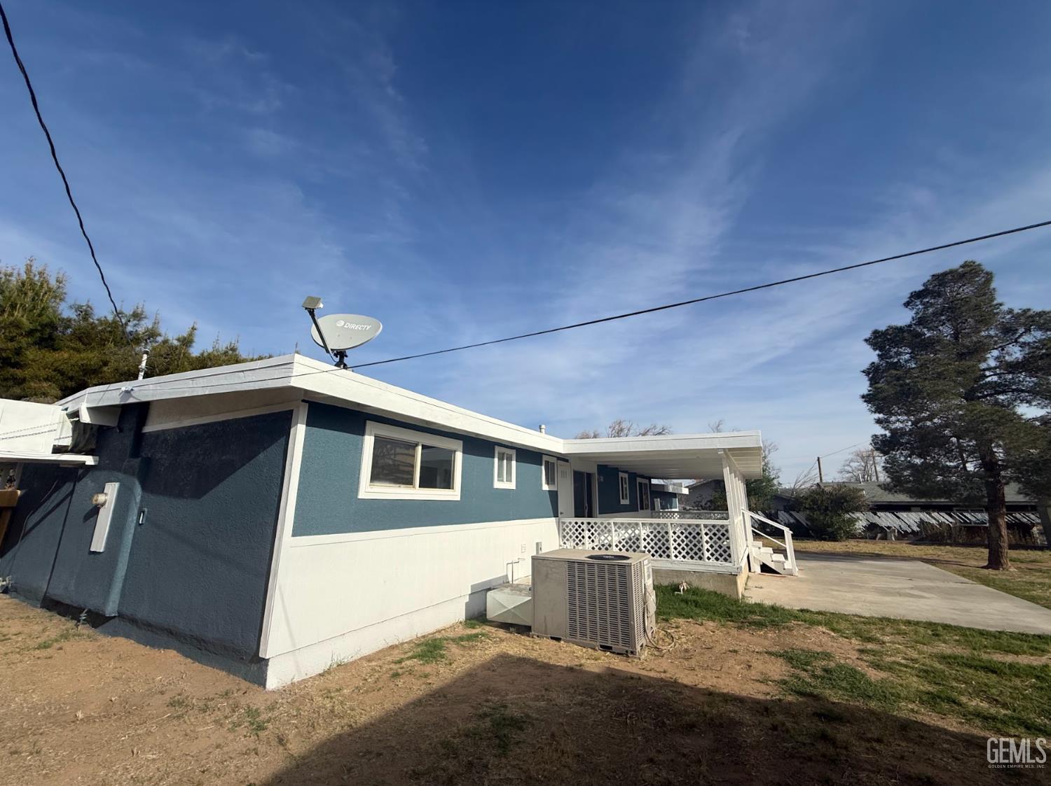 Undisclosed Address Ridgecrest, CA 93555 - Photo 20 of 45 a front view of a house with a yard