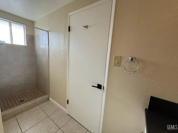 an empty room with wooden floor and closet