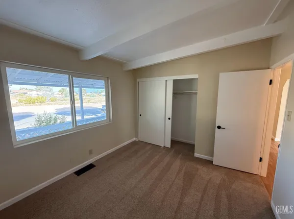 a view of a kitchen with a sink wooden floor and a kitchen