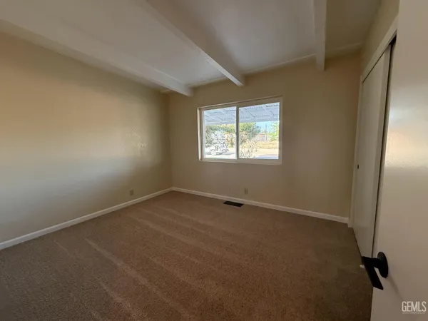 a kitchen with a sink and a refrigerator