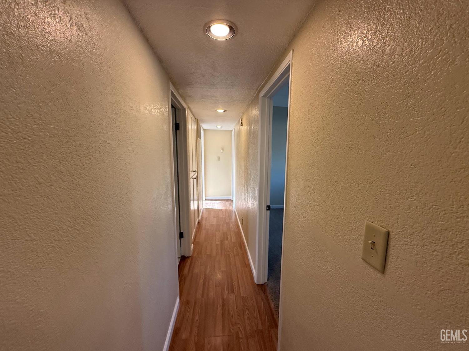 Undisclosed Address Ridgecrest, CA 93555 - Photo 33 of 45 a view of a hallway with wooden floor