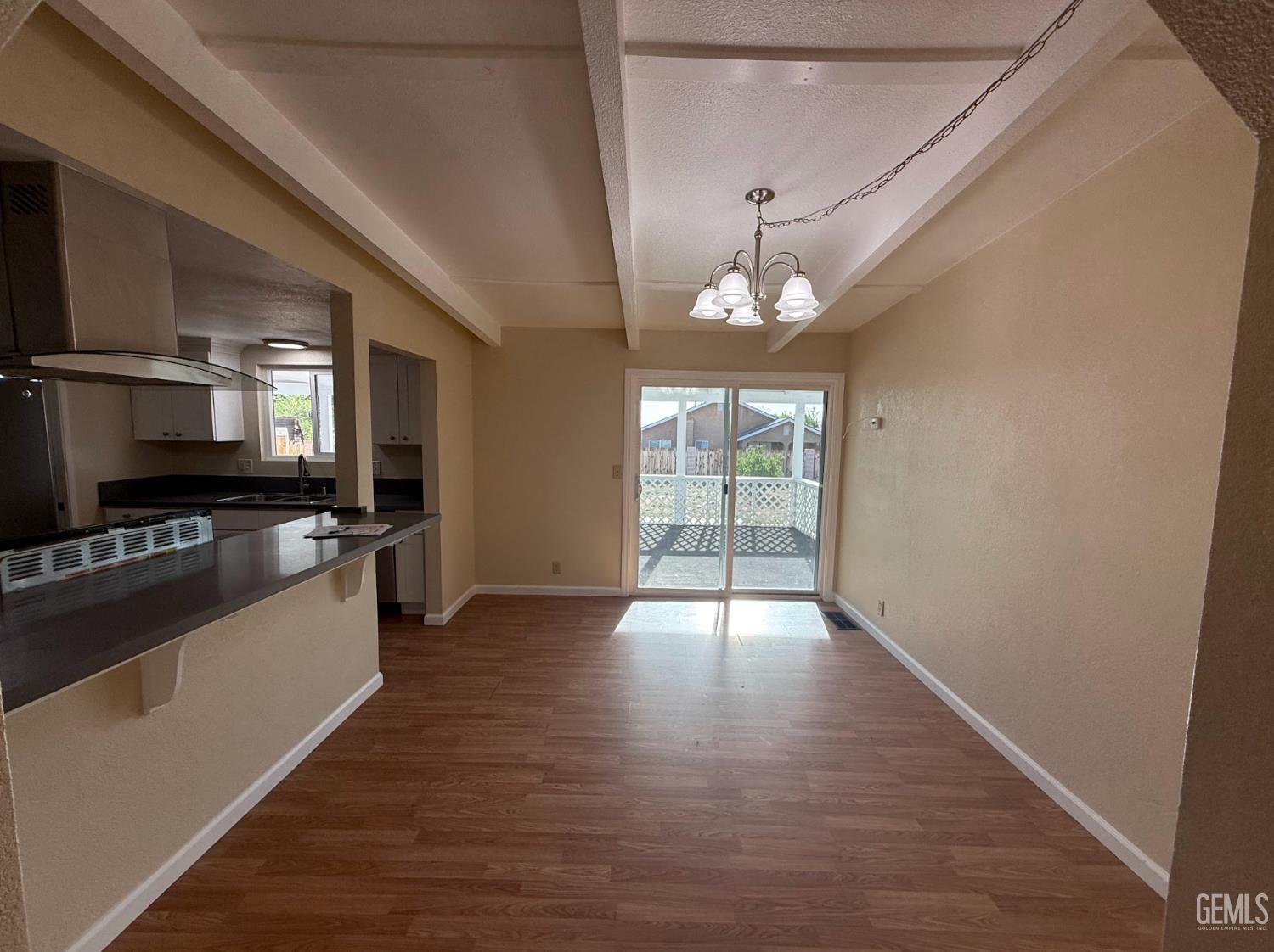Undisclosed Address Ridgecrest, CA 93555 - Photo 34 of 45 a view of a kitchen with a sink wooden floor and a kitchen