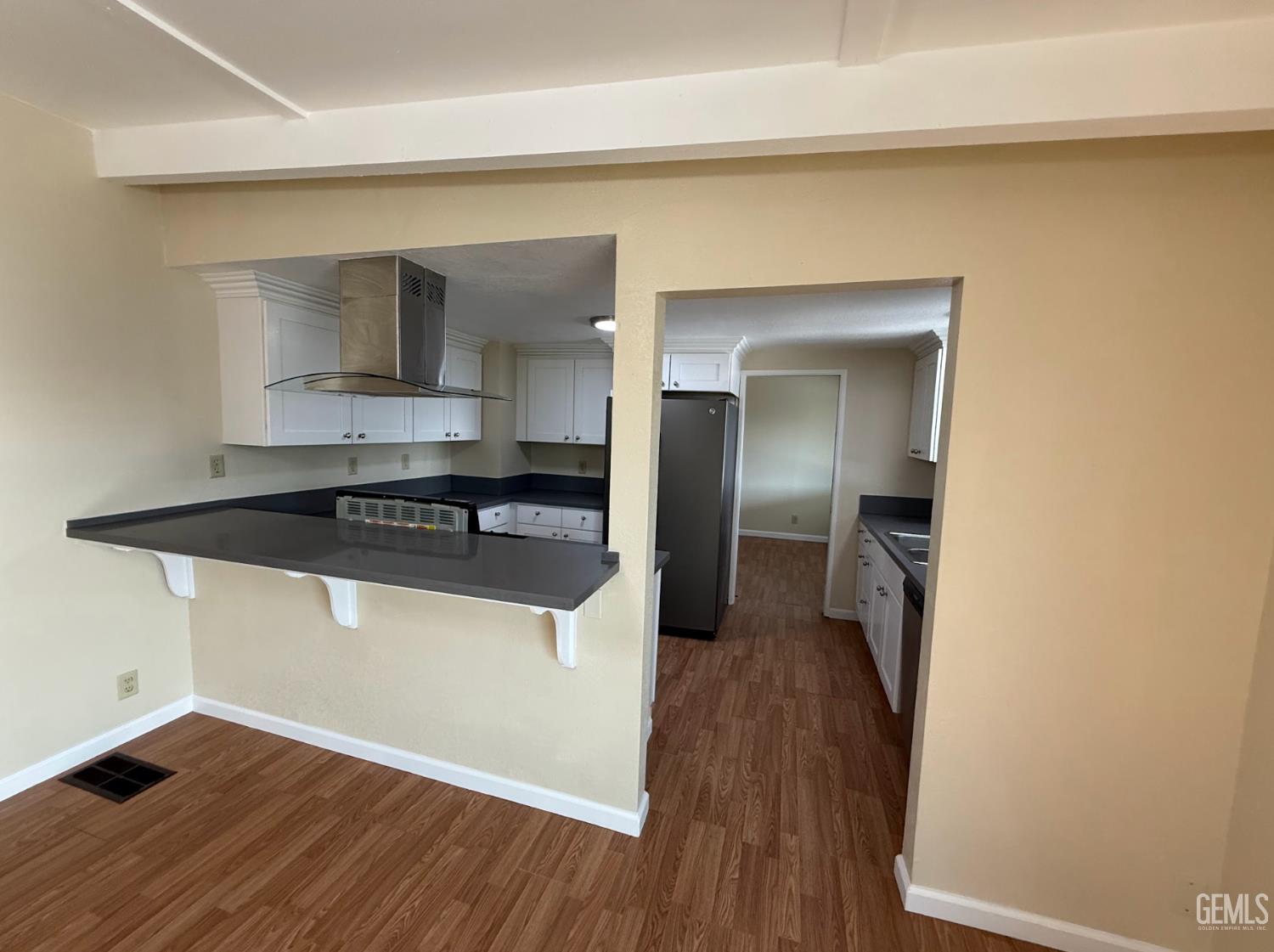 Undisclosed Address Ridgecrest, CA 93555 - Photo 38 of 45 a kitchen with a refrigerator and a sink