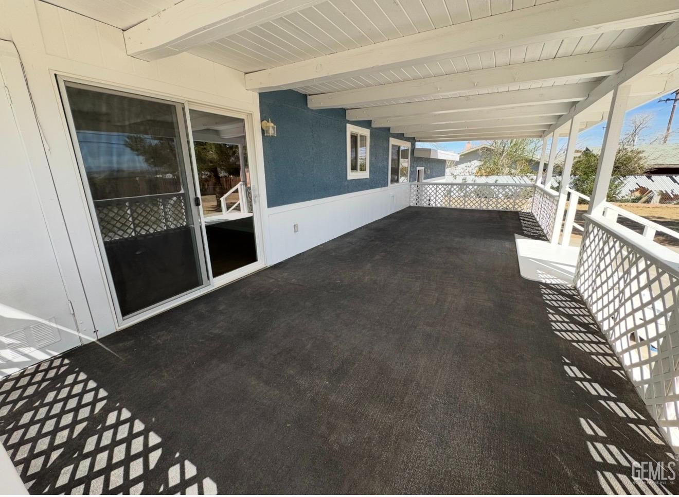 Undisclosed Address Ridgecrest, CA 93555 - Photo 4 of 45 a view of a hallway with wooden floor and a fireplace