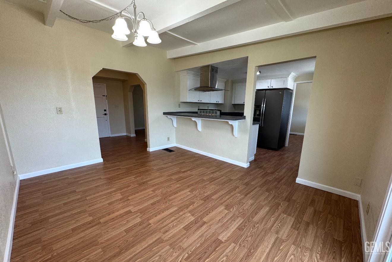 Undisclosed Address Ridgecrest, CA 93555 - Photo 6 of 45 a view of kitchen with stainless steel appliances granite countertop a refrigerator a stove top oven a sink and dishwasher with wooden floor