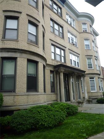 52 Cummings Road, Unit 4 Boston, MA 02135 - Photo 1 of 9 a view of a building with a yard