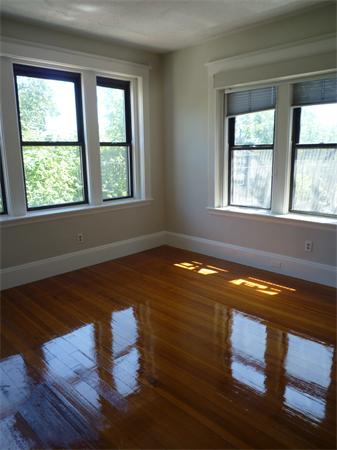 52 Cummings Road, Unit 4 Boston, MA 02135 - Photo 7 of 9 a view of empty room with wooden floor and window