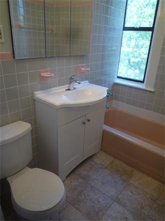 52 Cummings Road, Unit 4 Boston, MA 02135 - Photo 8 of 9 a bathroom with a sink toilet and shower