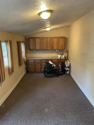 a kitchen with furniture and window