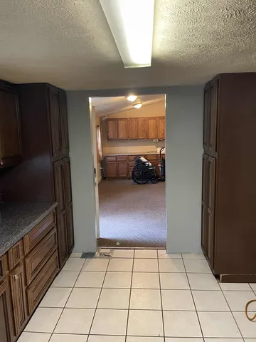 a view of a livingroom with a refrigerator