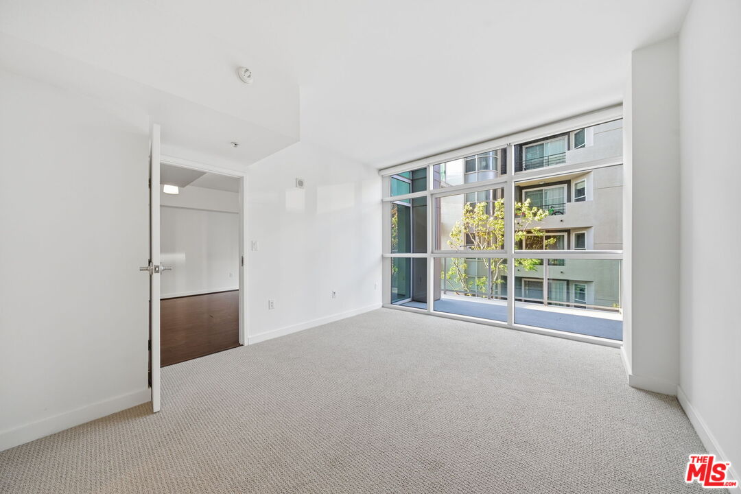 13700 Marina Pointe Drive, Unit 318 Marina del Rey, CA 90292 - Photo 21 of 75 a view of an empty room with a window