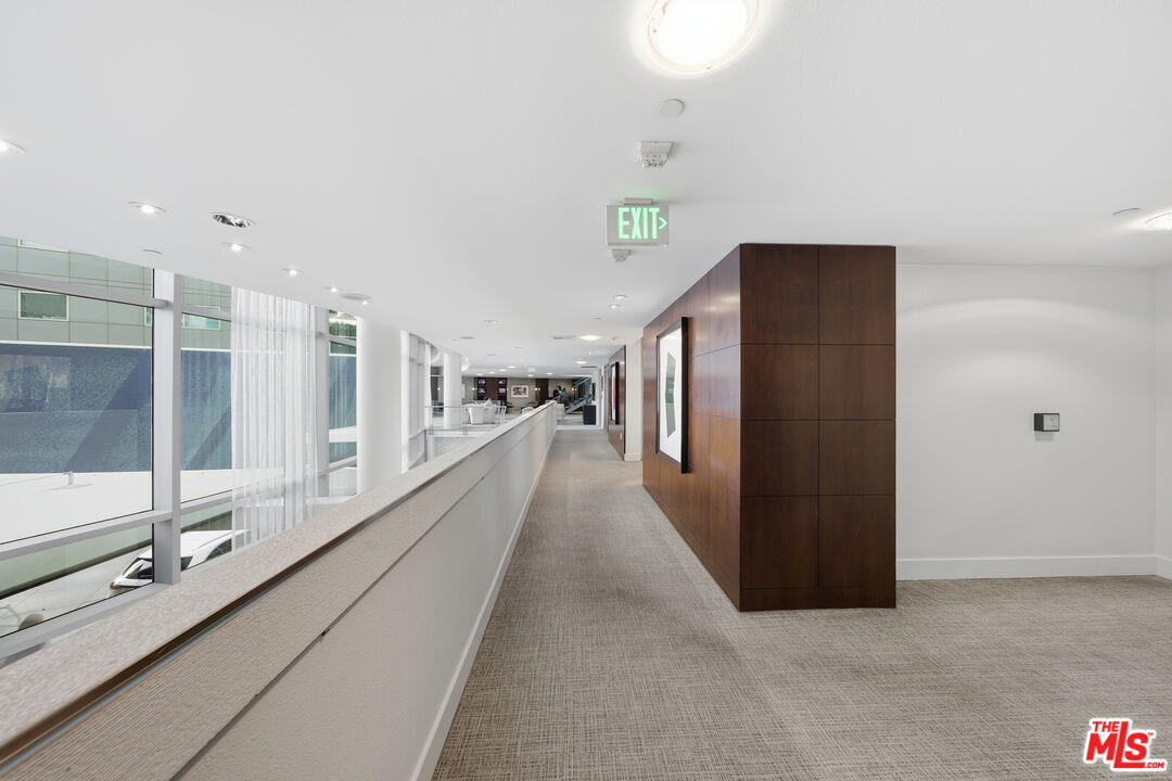 13700 Marina Pointe Drive, Unit 318 Marina del Rey, CA 90292 - Photo 37 of 75 a view of a hallway with windows
