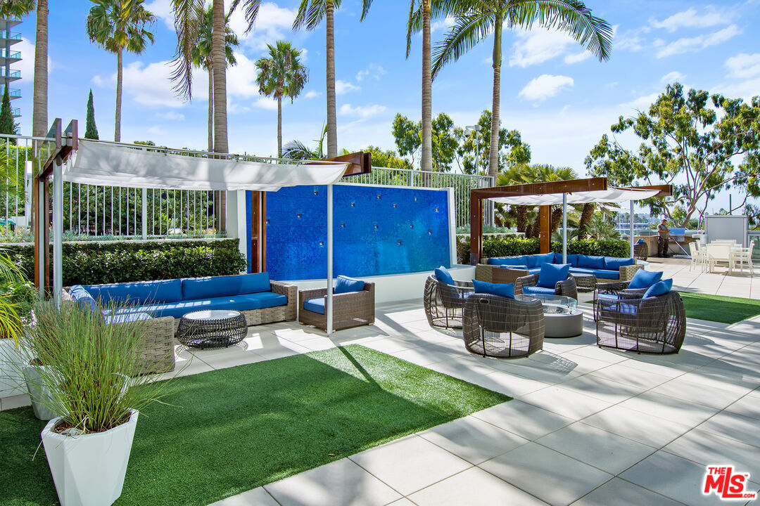 13700 Marina Pointe Drive, Unit 318 Marina del Rey, CA 90292 - Photo 45 of 75 a view of a backyard with sitting area and outdoor kitchen