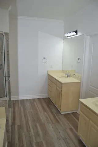 a utility room with cabinets washer and dryer