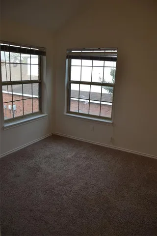 a bathroom with a toilet and bathtub