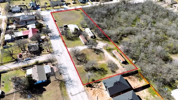an aerial view of house with yard