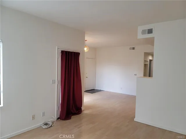 an empty room with a hallway