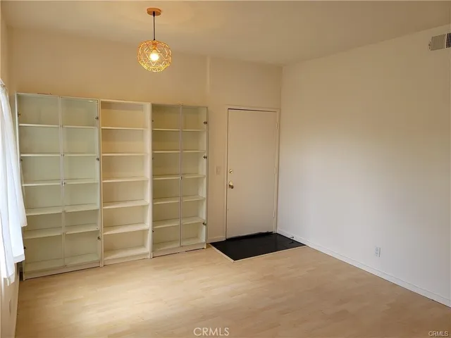 a view of an empty room with a empty shelves